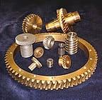 A worm gear and matched worm set with assorted worms and lead screws.